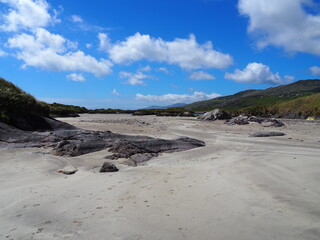 White sand beach in sunny weather in Ireland