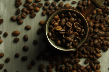 Black roasted coffee beans. Cezva cup coffee glass rustic style Turkish ground coffee