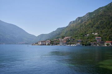 Fototapeta na wymiar Seaside small town against mountain in Montenegro