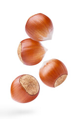 Flying delicious hazelnuts, isolated on white background	