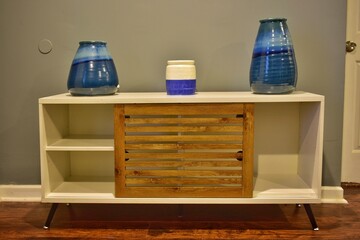 Wooden cabinet with ceramic pots