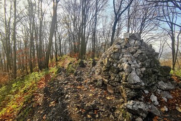 a stone cairn on top of a hill