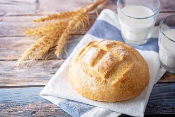 Wheat white bread with glasses of milk