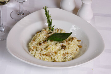 Risotto with mushrooms on the dinner plate.