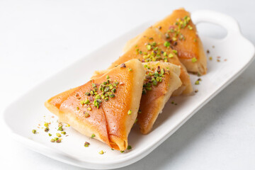 Traditional Turkish desserts; custard triangular dessert, albanian dessert ( Turkish name; Arnavut tatlisi or muhallebili muska tatlisi)