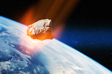 Planet Earth and big asteroid in the space. Potentially hazardous asteroids. Asteroid in outer...