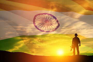 Silhouette of soldier on a background of India flag and the sunset or the sunrise. Greeting card...