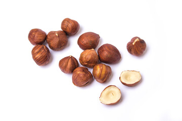 hazelnuts lie on a white background