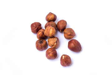 hazelnuts lie on a white background