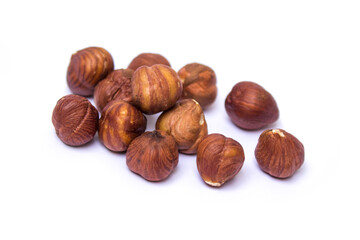 hazelnuts lie on a white background