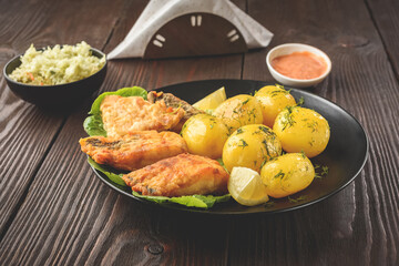 fried fish with new potatoes