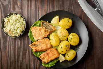 fried fish with new potatoes