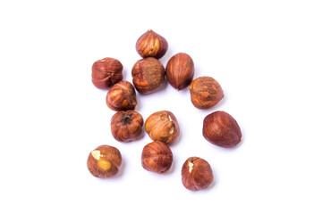 hazelnuts lie on a white background