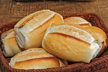 French bread basket on rustic wooden background