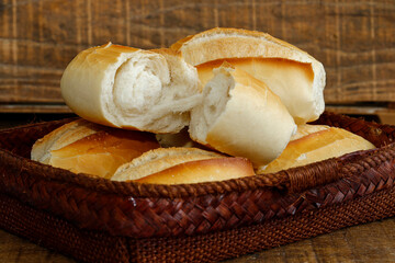 French bread basket on rustic wooden background