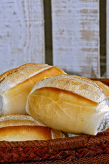 French bread basket on rustic wooden background