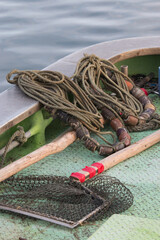 Traditional Japanese fishing equipment rope and nets on boat deck