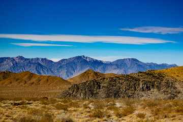death valley mountains under a cloud streaked sky