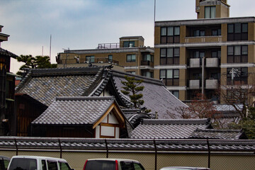 traditional temple architecture among modern city buildings