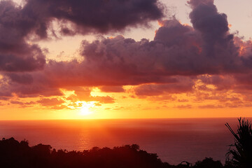 Fire sunset on the sea from the mountains