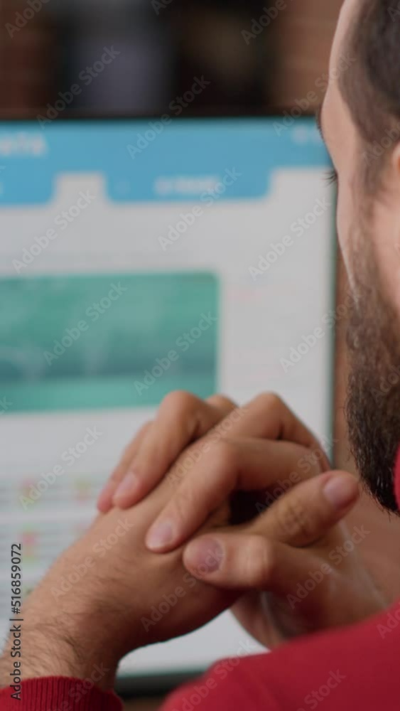 Poster vertical video: financial analyst looking at capital investment market on display, using stock trade