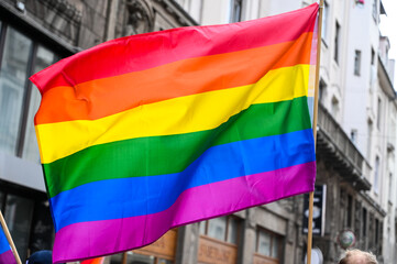 LGBTIQ flag on Pride march in city. A symbol of the LGBT community and social movements. Symbol of lesbian, gay, bisexual, transgender