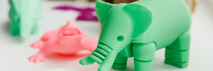 3D figures printed on an elephant, lizard, and snail printer. 3d toys for children. Web banner