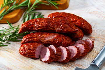 Close up of traditional Czech dried sausage on wooden surface