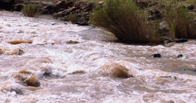 Slow motion footage of rapids on the olifants river during a flood. Kruger park