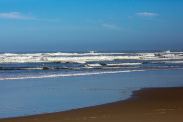 Breakers coming down on an Oregon beach in August