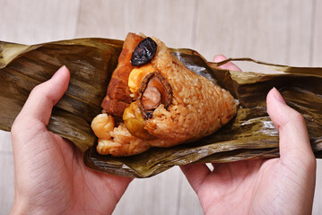 Hand Holding Zongzi Rice Dumpling