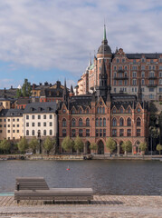 Fototapeta premium Old 1800s houses at the water front in the block at the street Bastugatan, a sunny summer day in Stockholm