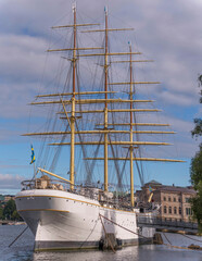 Stern of the steel sailing ship af Chapman and the royal castle in the old town Gamla Stan, a sunny...