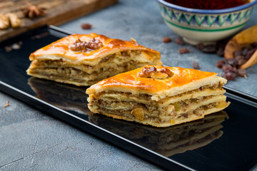 Traditional arabic dessert Baklava on grey table