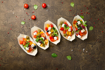 Greek salad with feta cheese and vegetables, canapes - obrazy, fototapety, plakaty