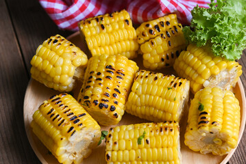 sweet corn cooked on plate background, sweet corn food with salad vegetable lettuce, ripe corn cobs...