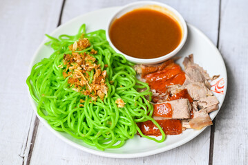 Jade noodle Asian Thailand food , roasted duck with jade noodle on white plate and duck sauce,...