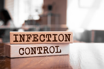 Wooden blocks with words 'Infection Control'.