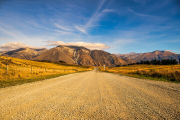 Gravel road in remote rural Coleridge area of the rugged dramatic foothills of the Southern Alps