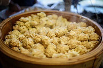 Food and beverage on sales with overall atmosphere of Amphawa where tourists come to relax and shop in the middle of the market.