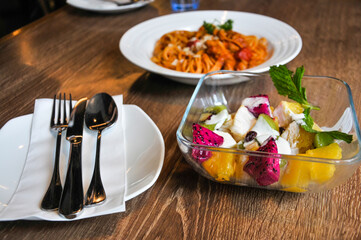 Pasta with meat and vegetable salad 