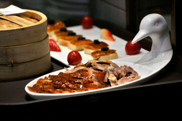 Beijing roasted sliced duck dinner on white plate 