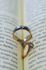 wedding rings on book