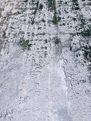 wet asphalt road background with raindrops and water puddles after rain