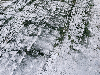 wet dark asphalt with raindrops. sidewalk with puddles of water.