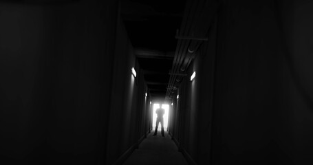 Image of man silhouette standing in dark corridor