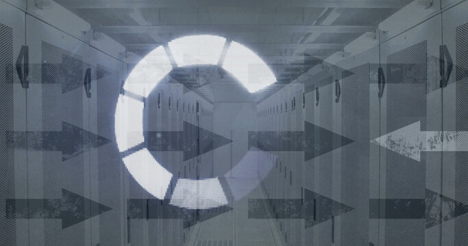 Image of loading ring over arrows and server room