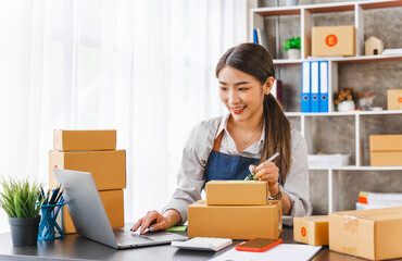 Entrepreneurs Small Business SME, Young Asian women happy after a new order from the customer,...