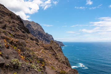 Fototapeta na wymiar Panoramic view of Atlantic Ocean coastline and Anaga mountain range on Tenerife, Canary Islands, Spain, Europe, EU. Looking at Cabezo el Tablero crag. Scenic coastal hiking trail from Afur to Taganana