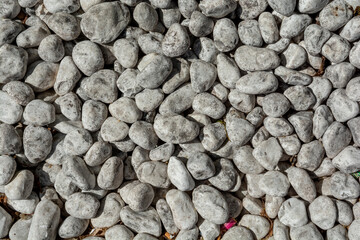White pebbles stones background. Top view.